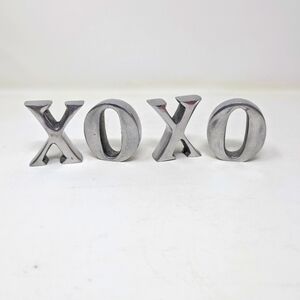 Silver colored XOXO (KISSES AND HUGS).